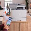 Brother MFC-L8970CDW color laser all-in-one printer with mobile printing in office setting