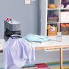 Brother embroidery machine on craft table with fabric and smartphone in organized workspace