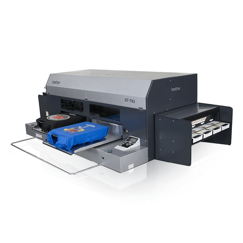 Brother GT-782 direct-to-garment printer printing colorful design on blue t-shirt