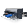 Brother GT-782 direct-to-garment printer printing colorful design on blue t-shirt
