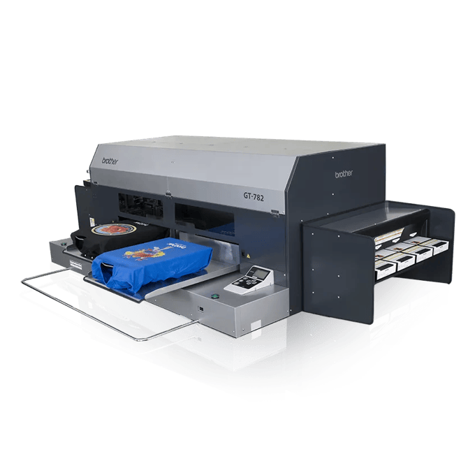 Brother GT-782 direct-to-garment printer printing colorful design on blue t-shirt