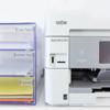Brother all-in-one printer with organized paper storage bins for home office
