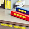 Brother wireless scanner on desk with organized binders and file folders