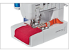 Brother cover stitch machine sewing red and orange fabric with precision stitching