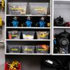 Organized storage shelves with clear bins holding yellow cables and blue wireless label makers