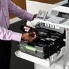 Person replacing toner cartridge in Brother HL-EX470W wireless color laser printer
