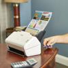Brother compact scanner printing colorful infographic on home office desk with USB drive