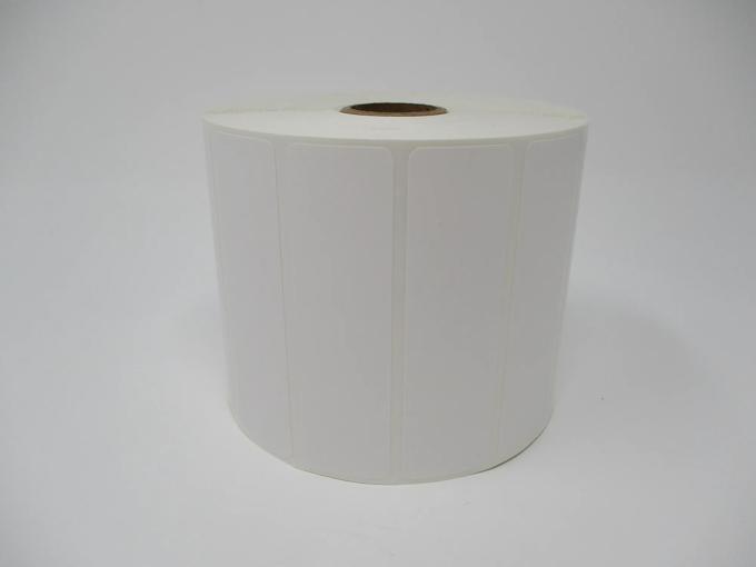 Roll of white die-cut labels on cardboard core for Brother label printers