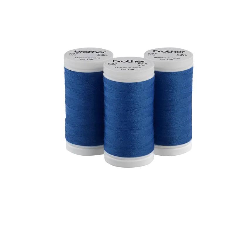 Three Brother blue sewing thread spools on white background