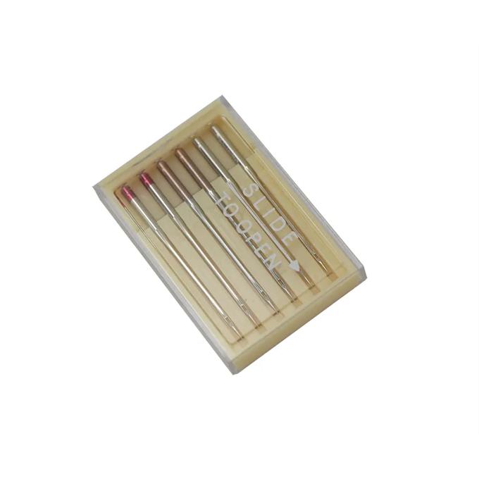 Brother embroidery machine needles in wooden case with assorted sizes