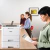 Woman printing document on Brother laser printer in modern office meeting room