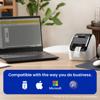Brother QL-800 label printer on desk with laptop displaying label design software