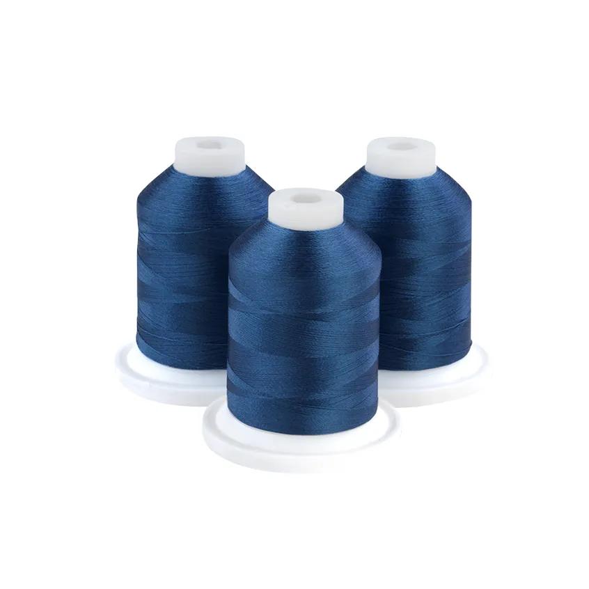 Three blue embroidery thread spools on white bases for sewing and crafting projects