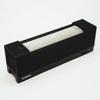 Brother wireless speaker with ribbed black design and white accent panel
