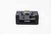 Brother BMS-432 battery eliminator with orange tab and mounting slots, front view