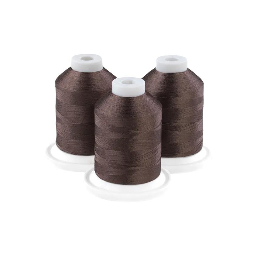 Three spools of old sage embroidery thread on white bases