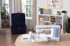 Brother embroidery machine with touchscreen and carrying case in bright craft room