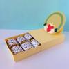 Colorful polka dot fabric rolls in cardboard box with decorative paper craft display