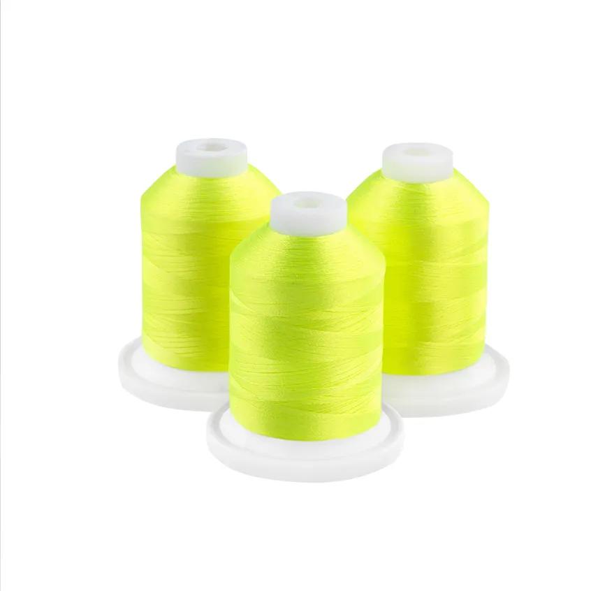 Brother embroidery thread spools in neon yellow with white caps on white background